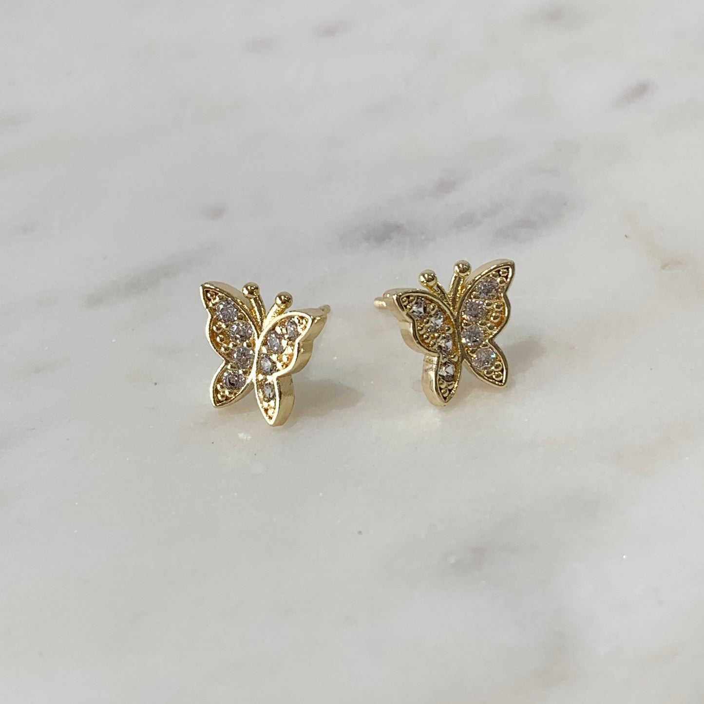 Aretes mariposas con brillos dorados