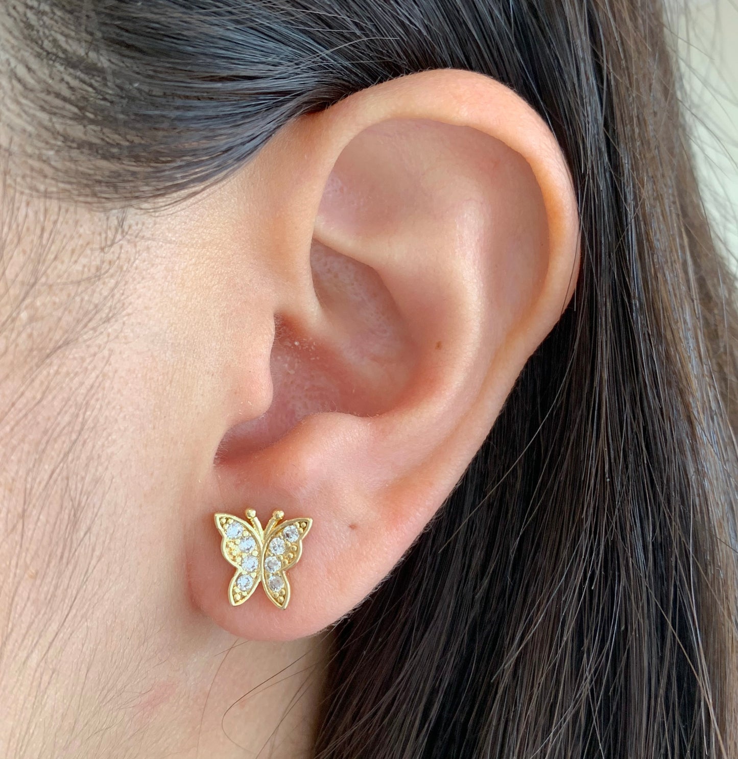 Aretes mariposas con brillos dorados