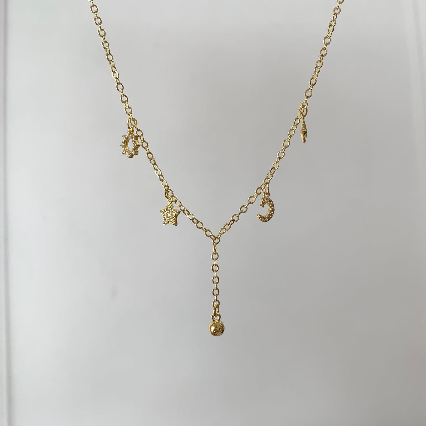 Collar dijes Estrellas , lunita y bolita