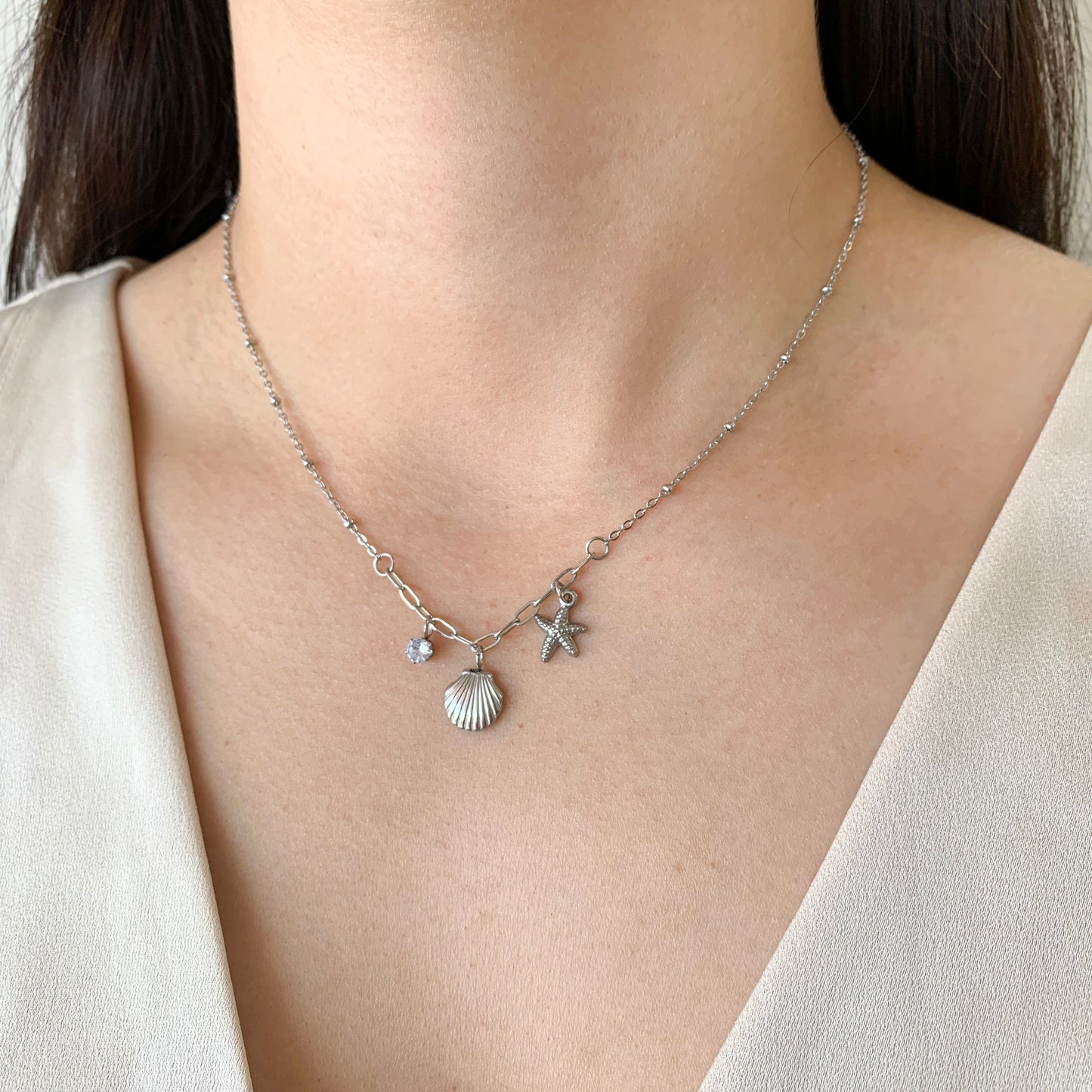 Collar a charms estrella de mar y conchita mini