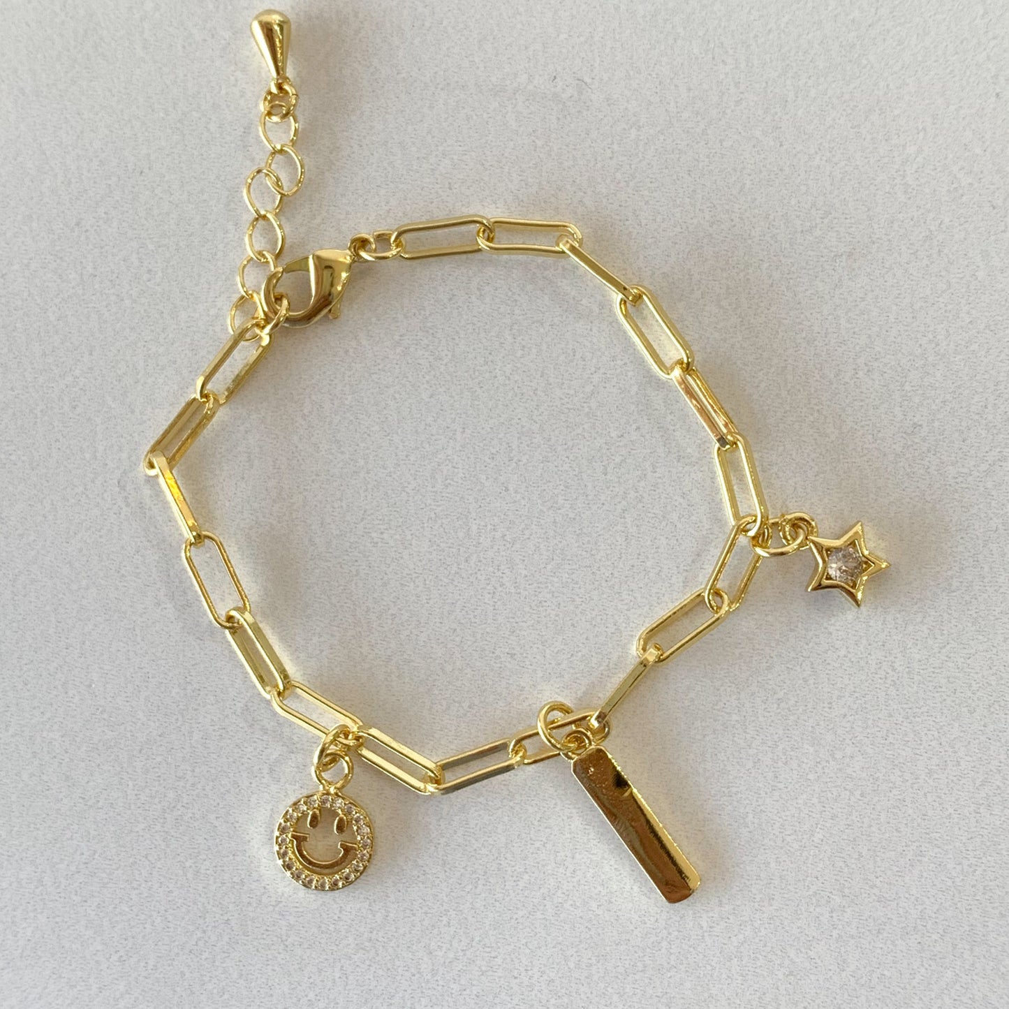 Pulsera charms carita feliz