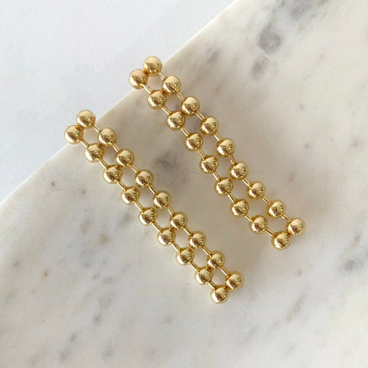Aretes dos tiras bolitas largos