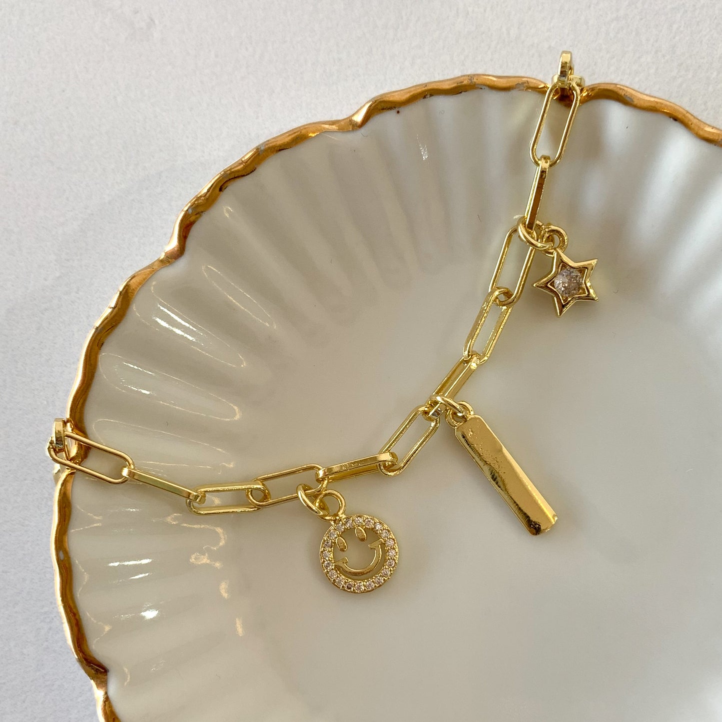 Pulsera charms carita feliz